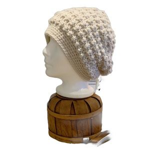 Hat slouchy style. Neutral ecru color. Fits adult or teen.
